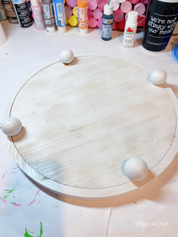 gluing on wooden balls to tray