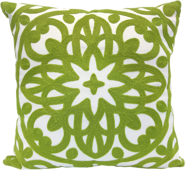 green and white embroidered pillow