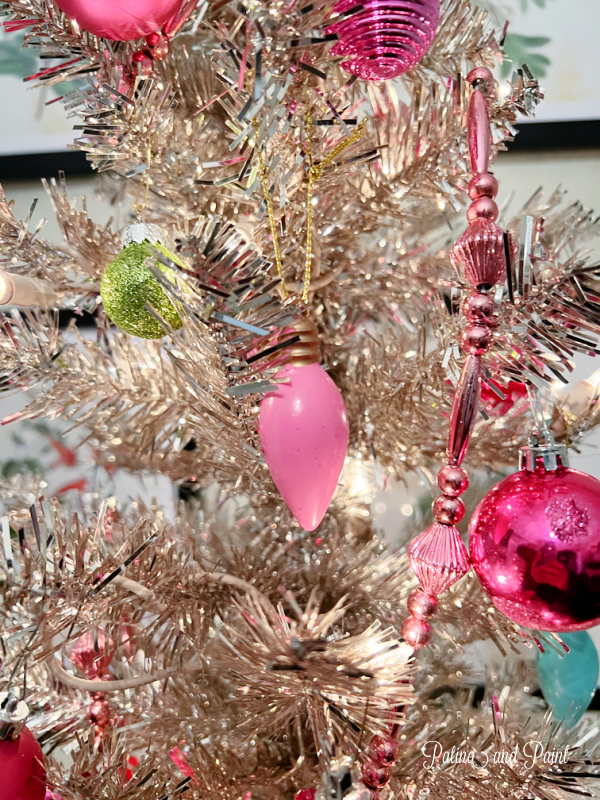 pink ornament on silver tree