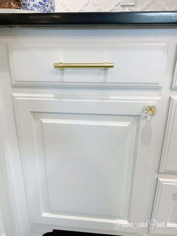 white cabinet, gold hardware