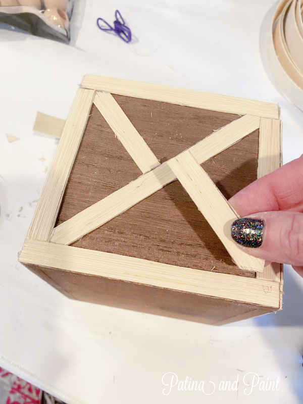 adding wood strips to a box